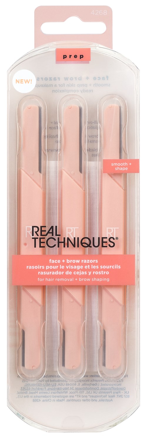 Ett set med tre rosa pincetter med vita spetsar i ett genomskinligt plastpaket. Märkningen lyder "Real Techniques."
