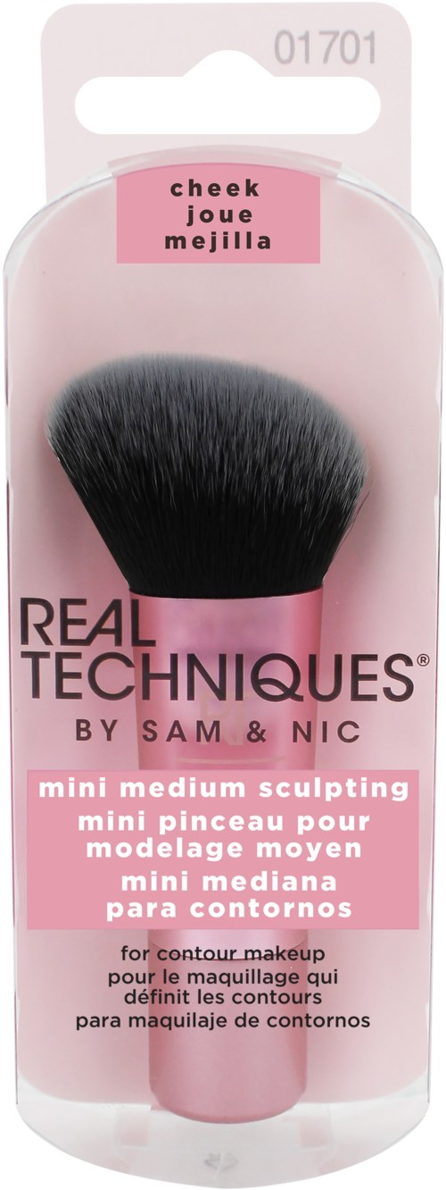 A makeup brush in clear packaging with pink labels, used for contouring and face shaping.
