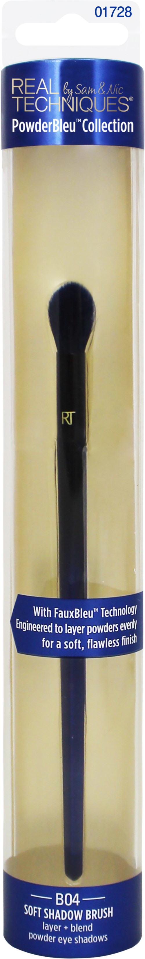 En lång, svart makeupborste i tydlig förpackning, märkt 'Real Techniques Powder Brush Collection.'