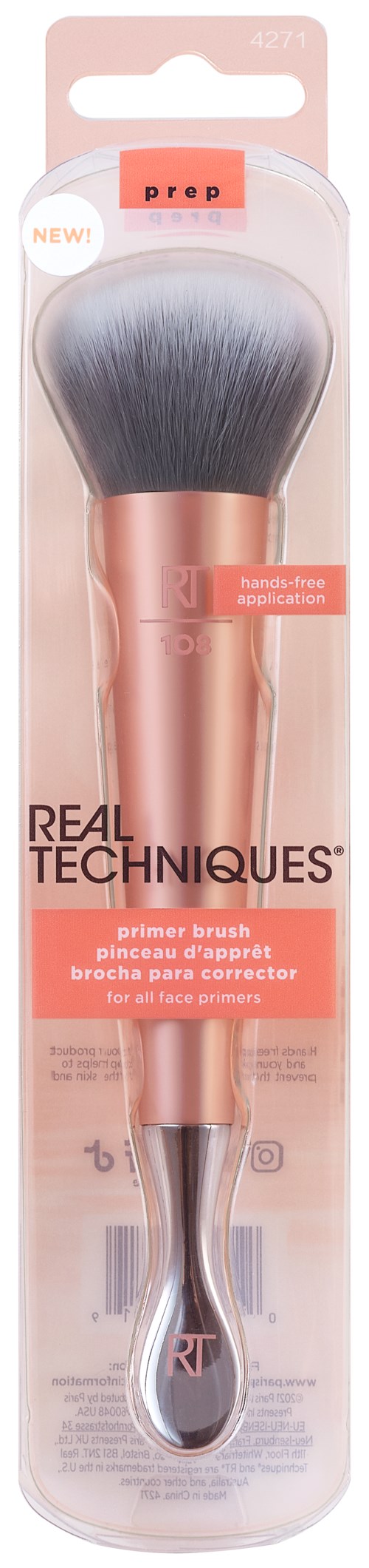 En rosa sminkborste med grå borst, i genomskinlig förpackning, märkt 'Real Techniques Primer Brush'.