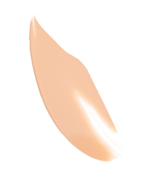 A beige liquid or cream with a shiny, smooth texture, shaped like a teardrop.