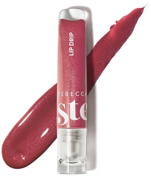 Läppglanstub med rosa nyans och en provswatch bakom den. Etiketten säger "Rebbecca Ste" och "Lip Drip."