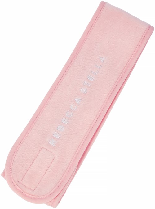 En rosa handduk med orden 'heliocare stella' broderat på den. Handduken är vikt noggrant.