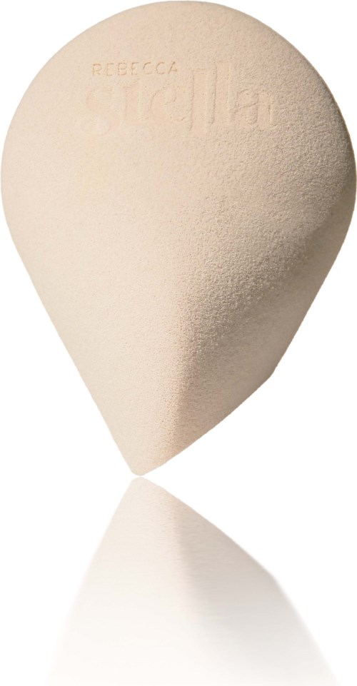 En beige skönhetsblandare med präglat varumärke och texturerad yta, formad som ett ägg.