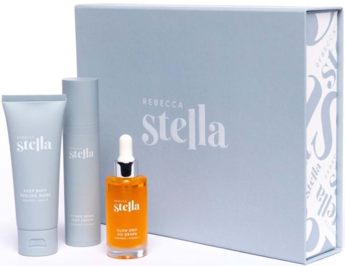 A skincare set with three products and a large light blue box, featuring the brand Rebecca Stella.