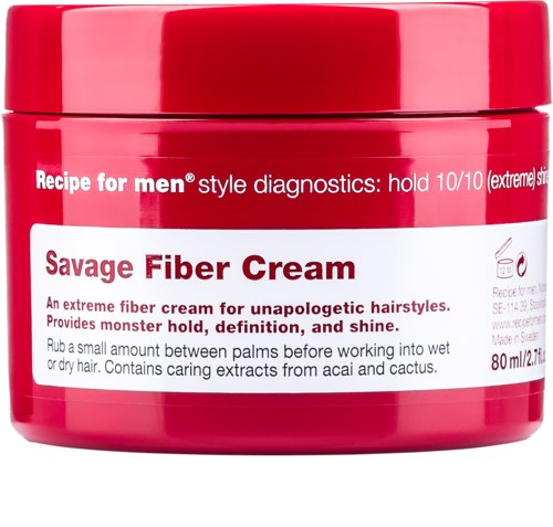 En röd burk med Savage Fiber Cream för opopullegstylingar, med instruktioner och varumärkesdetaljer på etiketten.