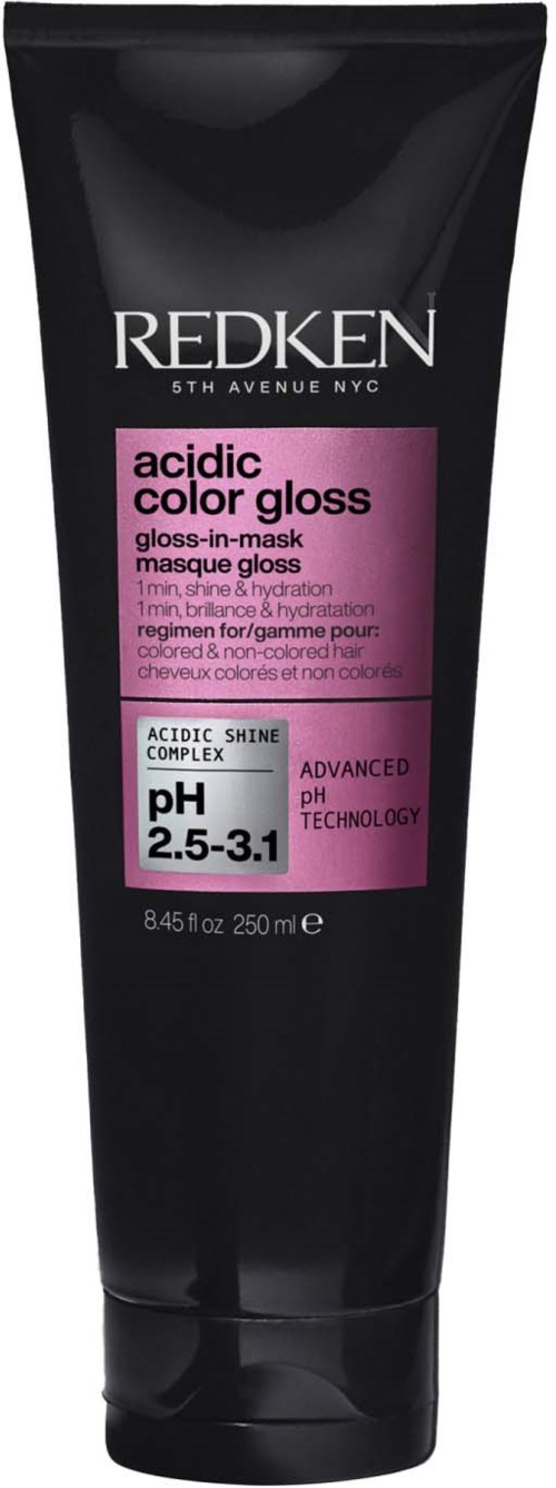 A black tube of Redken acidic color gloss mask for hair with pink label, mentioning pH 2.5-3.1.