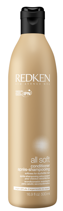 En beige flaska med Redken all soft balsam med svart lock, märkt för dagligt bruk, 16,9 fl oz.