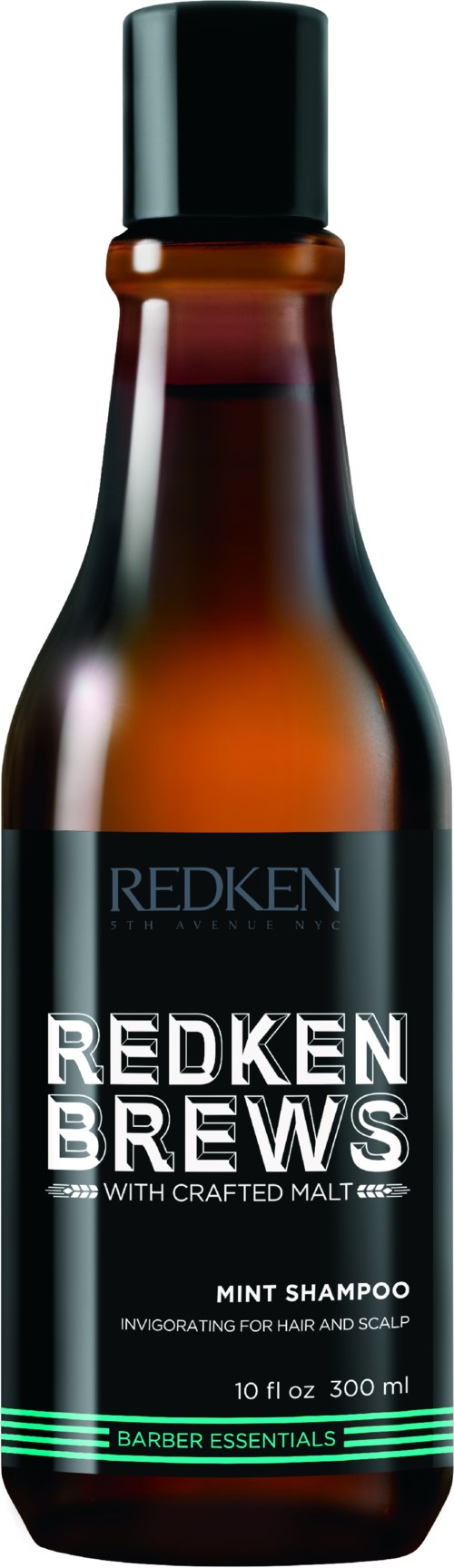 En brun flaske med svart lokk, merket "Redken Brews Mint Shampoo," designet for hår og hodebunn.