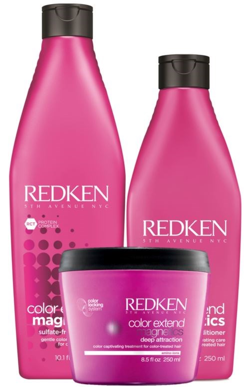 Two pink bottles and a pink jar of hair care products from Redken, with black caps, on a white background.