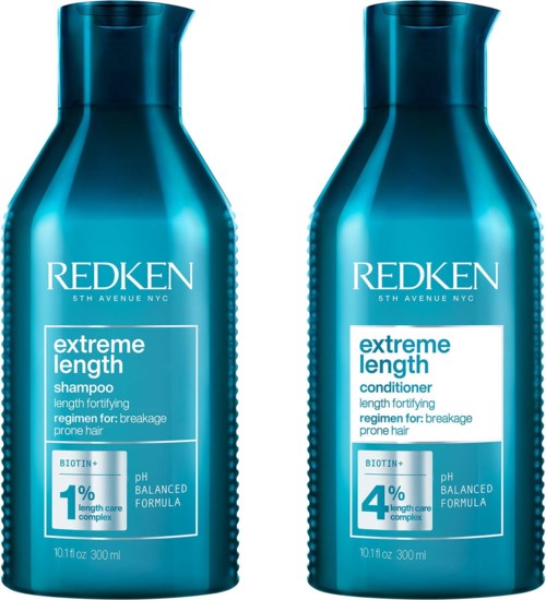 Två blå flaskor av Redken Extreme Length schampo och balsam bredvid varandra. De är för håravfall och hårväxt.
