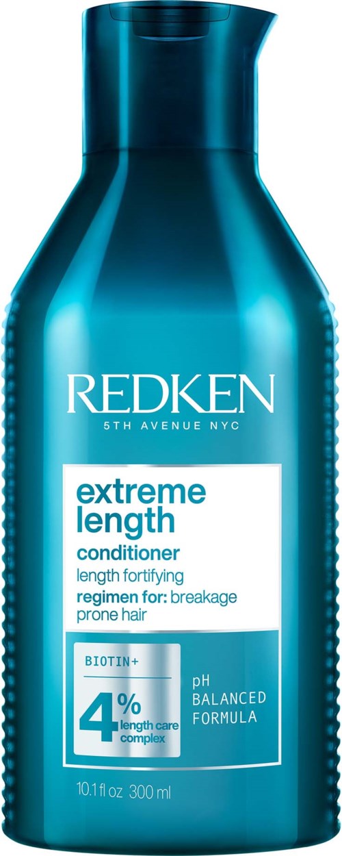 En blå flaska med Redken Extreme Length balsam med vitt och blått text och lock på toppen.