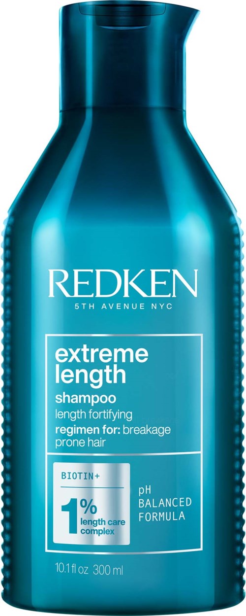 Blå flaska med Redken extreme length schampo för skadat hår, med pH-balans och biotin.