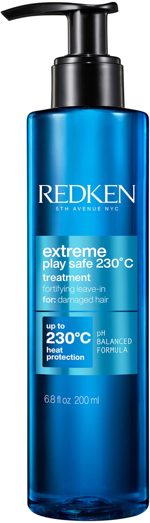 Blå flaske med Redken extreme play safe-behandling til beskadiget hår, beskytter mod varme op til 230°C, 200 ml.