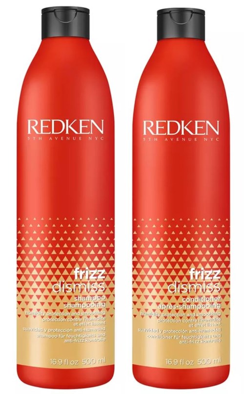 Two red bottles labeled 'REdken' with black caps, featuring gold and white triangular design and product name 'frizz dismiss'.