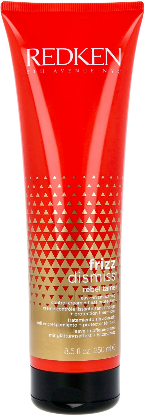 En röd tub med Redken hårprodukt märkt 'Frizz Dismiss Rebel Tame' med guld- och vita triangelmönster.