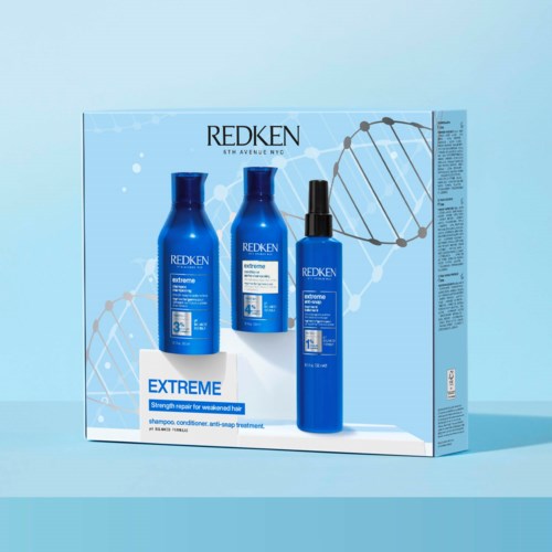 Sininen rasia, jossa on kolme Redken-hiustuotetta nimeltä 'Extreme' vaurioituneen hiuksen korjaamiseen, DNA-kierteideni kanssa.