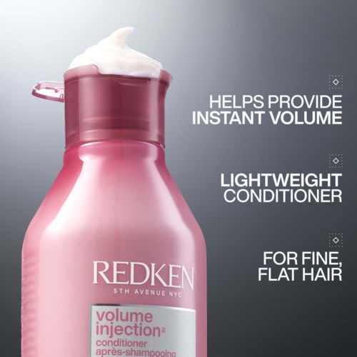 Rosa flaska med Redken volymbalsam med skum ovanpå, påstås öka volymen för tunt, platt hår.