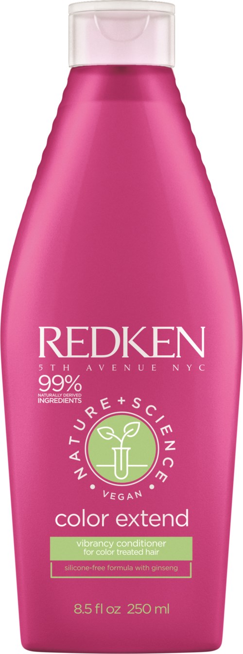 Pink bottle of Redken conditioner with green and white label, indicating it's vegan and for color-treated hair.