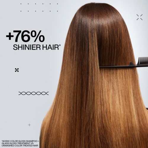 Long, shiny, smooth brown hair being combed or styled. Text says hair is 76% shinier.