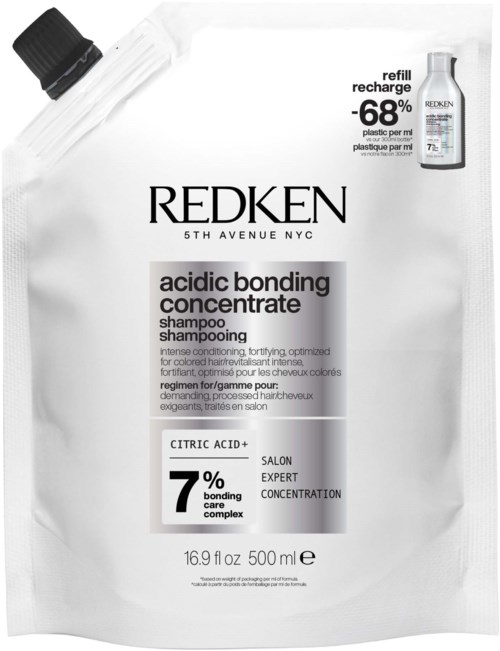Hvid shampoo refillpose med sort og grå tekst, mærket 'Redken Acidic Bonding Concentrate' og angiver 7% binding care complex.