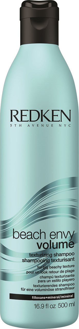 A tall, light blue shampoo bottle with black cap, labeled 'Redken Beach Envy Volume'.