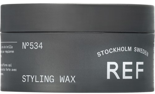 Grå låda märkt 'Ref' och 'Styling Wax' från Stockholm, Sverige. Innehåller stylingvax produktnummer 534.