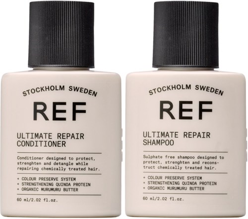 Two bottles of hair care products, one is shampoo and the other is conditioner, both are from the REF brand.
