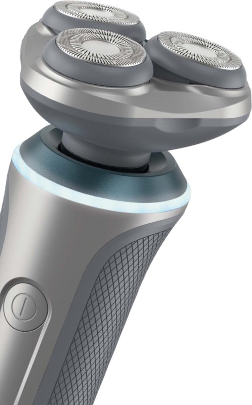 Electric shaver with three circular blades and a textured grip handle.