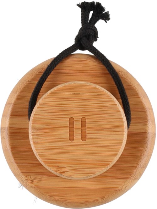 A round bamboo object with a smaller round lid in the center, tied with a black string.