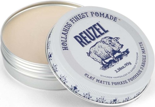 A round metal tin containing light beige hair wax, labeled 'Reuzel' with a pig illustration, used for styling hair.