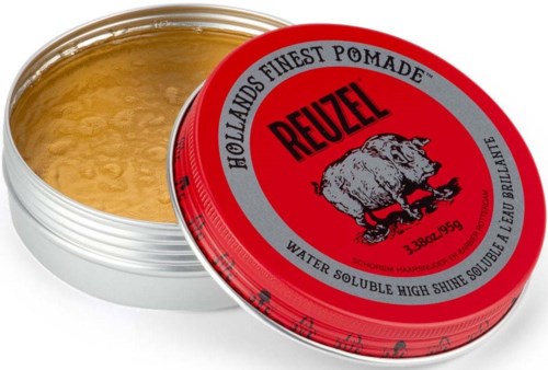 A small round container of hair pomade with a red lid and a bear logo, partially open showing the golden product inside.