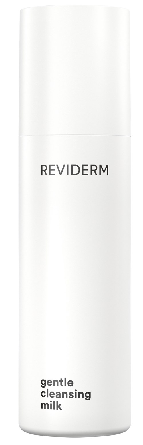A white bottle labeled Reviderm gentle cleansing milk stands upright with a minimalist design.