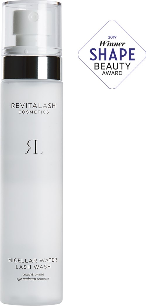 En vit flaska med genomskinlig lock och svart band, märkt 'Revitalash Cosmetics' och 'Micellar Water Lash Wash.'
