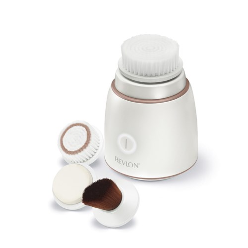 A white Revlon facial cleaning device with two attachments, one brush and one sponge, on a white background.