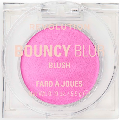 A bright pink blush in clear plastic packaging with the words "BOUNCY BLUR" and other product details printed on it.