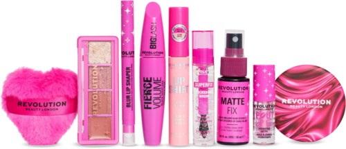 En samling rosa skönhetsprodukter inklusive makeup, hudvård, hårvård och tillbehör uppställda i rad.