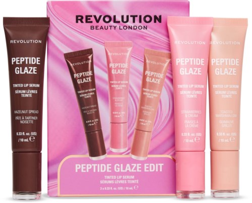 Dreiersatz mit pinken und braunen Lippenserum-Tuben und einer pinken Box mit Revolution-Logo.