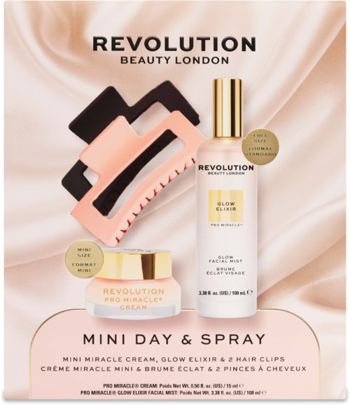 Revolution Beauty London logo met mini miracrem, glow elixir en twee haarklemmen op een zachte satijnen achtergrond.