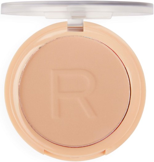 Kompakt sminke puder med rund form, lys beige farge, og et bokstav 'R' preget på overflaten.
