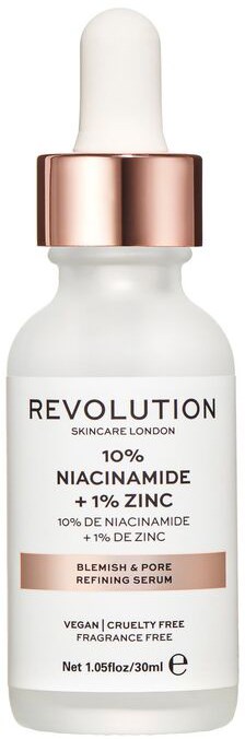 A white skincare bottle with a dropper contains niacinamide and zinc for blemish and pore refining.