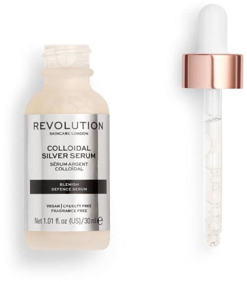En liten flaska av silverserum med pipett bredvid, märkt för hudvård, vegansk och cruelty free.