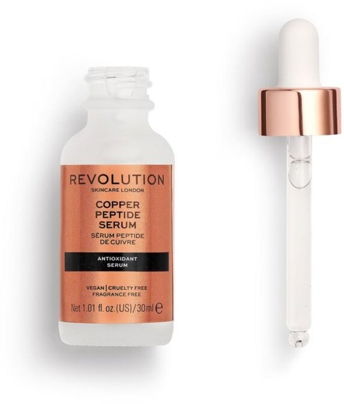 En hudvårdsflaska märkt 'Revolution Copper Peptide Serum' med en pipett bredvid.