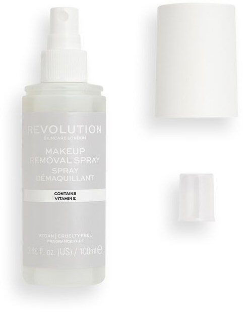 En liten sprayflaska märkt 'Revolution Makeup Removal Spray' med ett lock och en liten behållare bredvid.