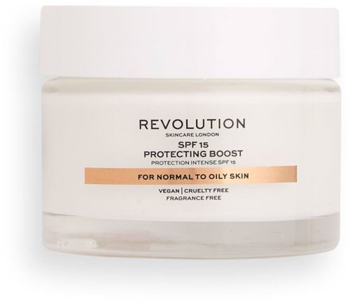 Ett burk med Revolution hudvårdscreme med SPF 15, lämplig för normal till fet hud, vegansk och parfymfri.