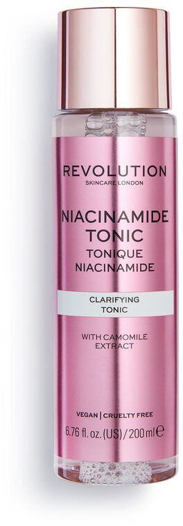 En rosa flaska märkt 'Niacinamide Tonic' med ett roséguldcap, innehåller klarande toner med kamomillextrakt.
