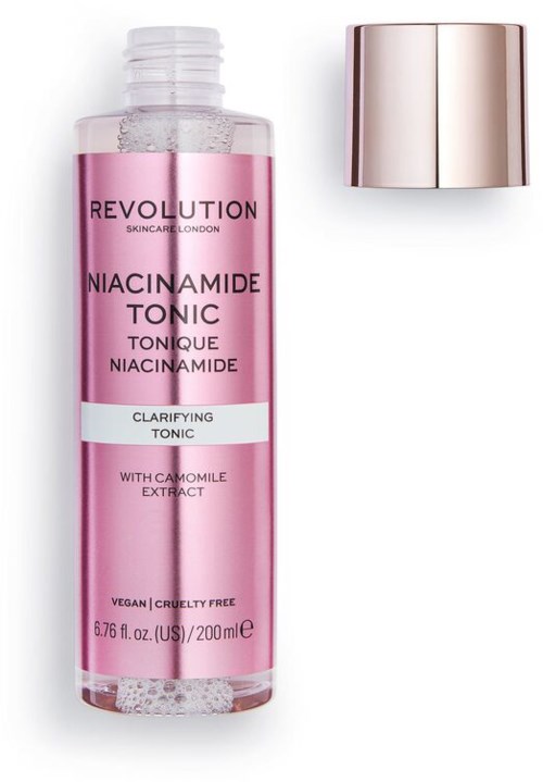En rosa flaska märkt "Niacinamide Toner" med en silverkapsel bredvid.