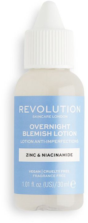 En liten vit flaska med pipett, märkt som Revolution Skincare London nattlig Blemish Lotion med zink och niacinamide.
