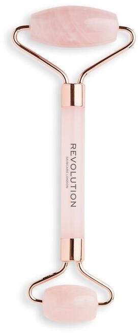 En rosa ansiktsrulle med to avrundede steiner og et håndtak som sier "REVOLUTION".