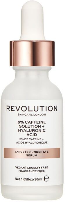 Liten hvit flaske med pipette, merket 'Revolution Skincare London', som inneholder øyeserum med koffein og hyaluronsyre.